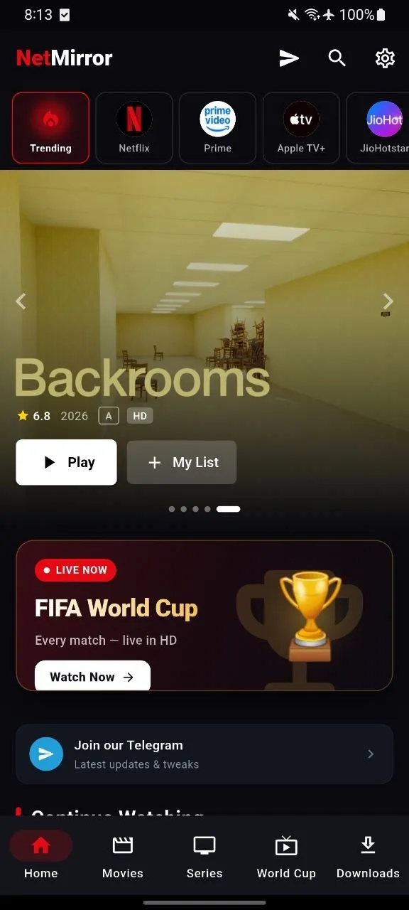 NetMirror Android — The home tab: Opens already loaded — a trending banner with Play and + My List, a live World Cup rail, and Movies, Series and Downloads a tap away.